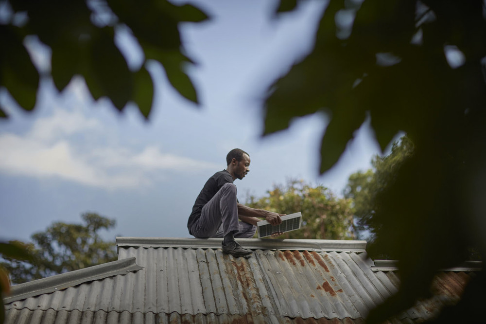 A man installing a solar panel