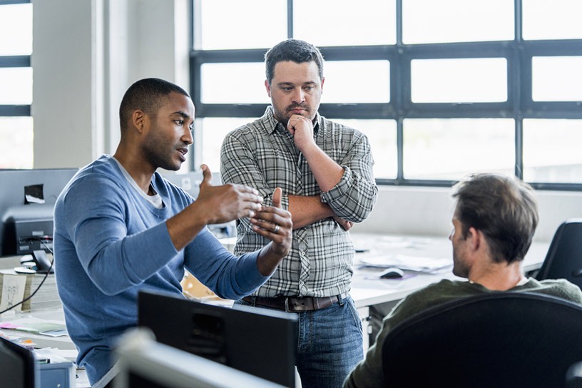 Picture of workers talking.